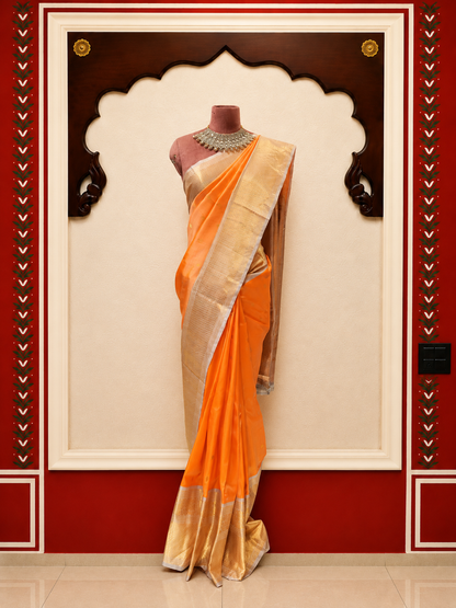 ZARTARI Handwoven Banarasi Silk Saree – Peach Orange with Silver-Gold Zari Border & Rich Woven Pallu